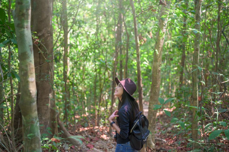 Free Image of Solo woman trekking and enjoying time in the woods 
