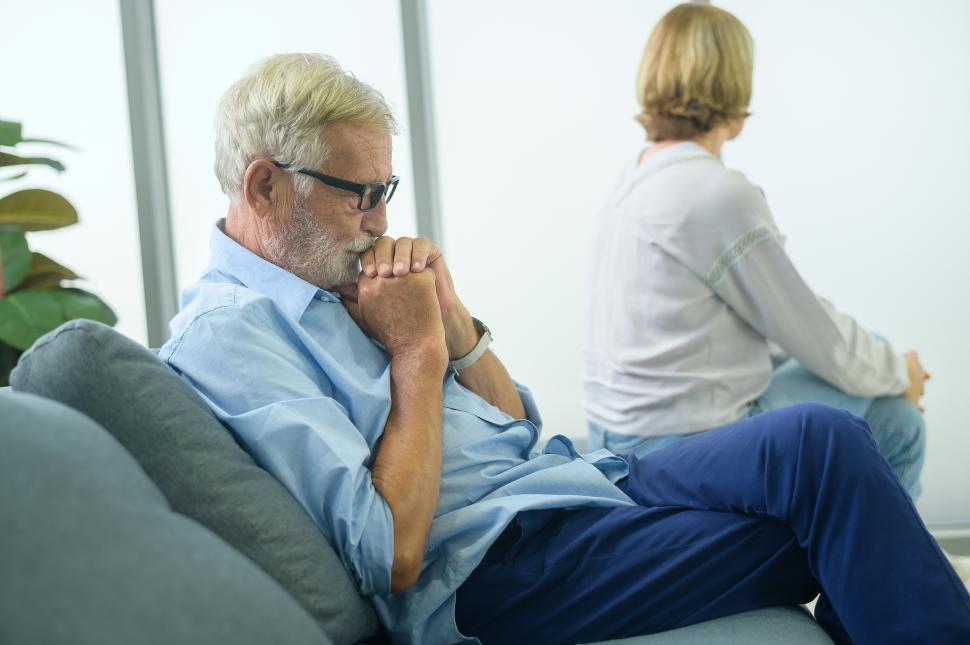 Free Image of Senior citizens feeling depressed and upset, sitting ignoring each other on a couch 