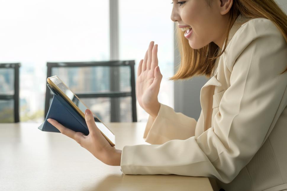 Free Image of A young business Woman looking at screen while business meeting through video conferencing application in modern office 