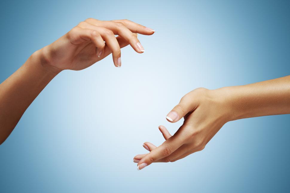 Free Image of Hands on blue background, framing and focusing on central area 