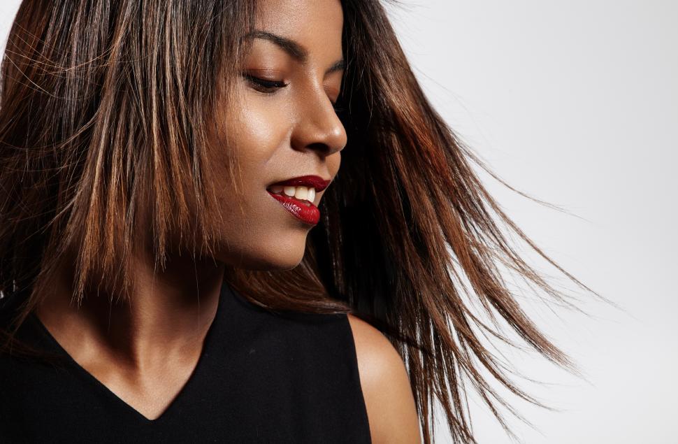 Free Image of women in profile view with a fluttering hair 