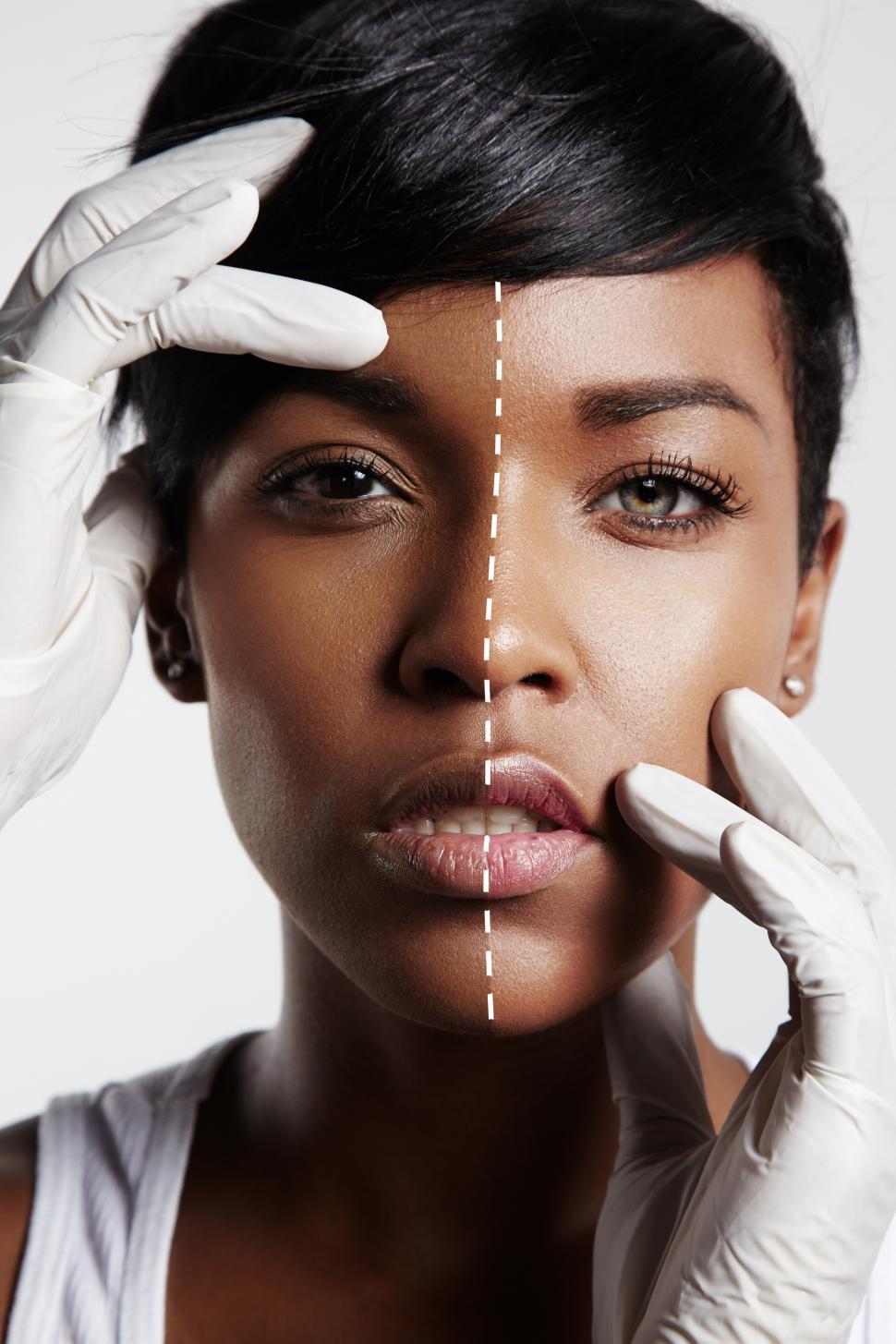 Free Image of portrait of a black woman with a half of a face lighter or brighter 