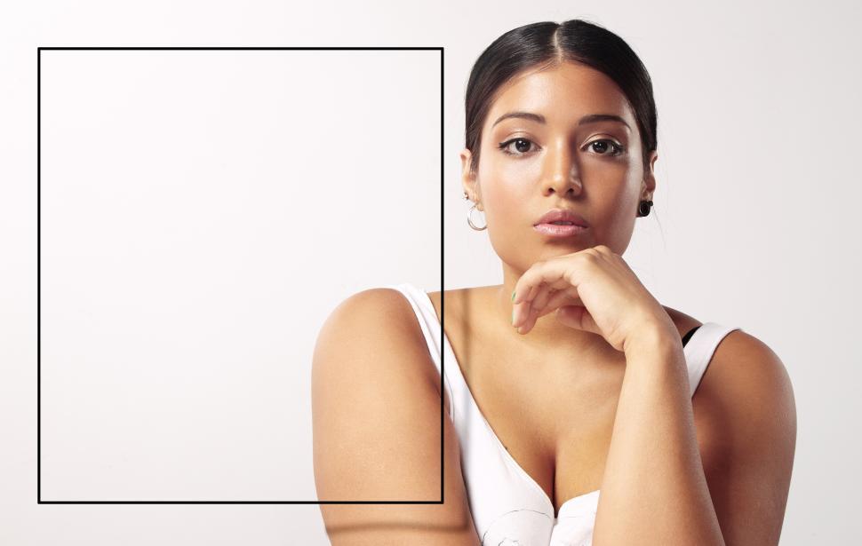 Free Image of Woman with a 3d frame for text placement with copyspace 