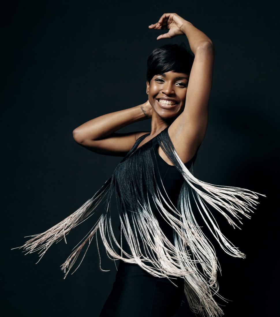 Free Image of happy woman is dancing wearing pretty dress 