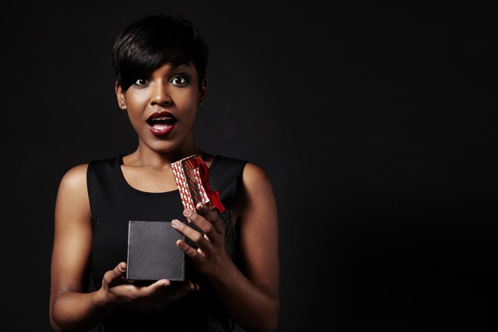Free Image of women surprised after opening an elegant gift box 