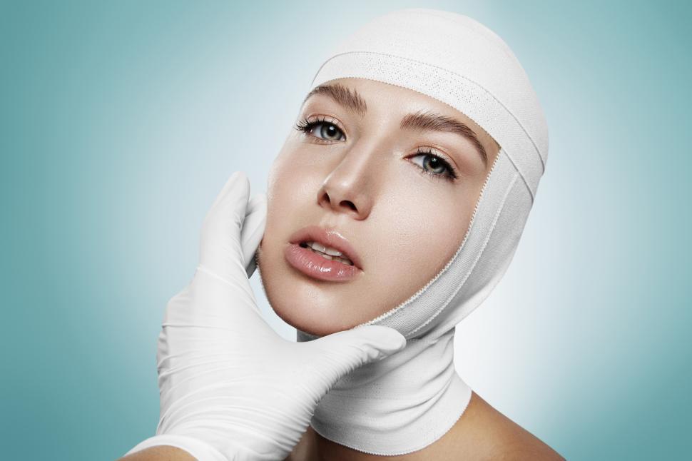 Free Image of Hand of a doctors manipulating a bandaged woman  
