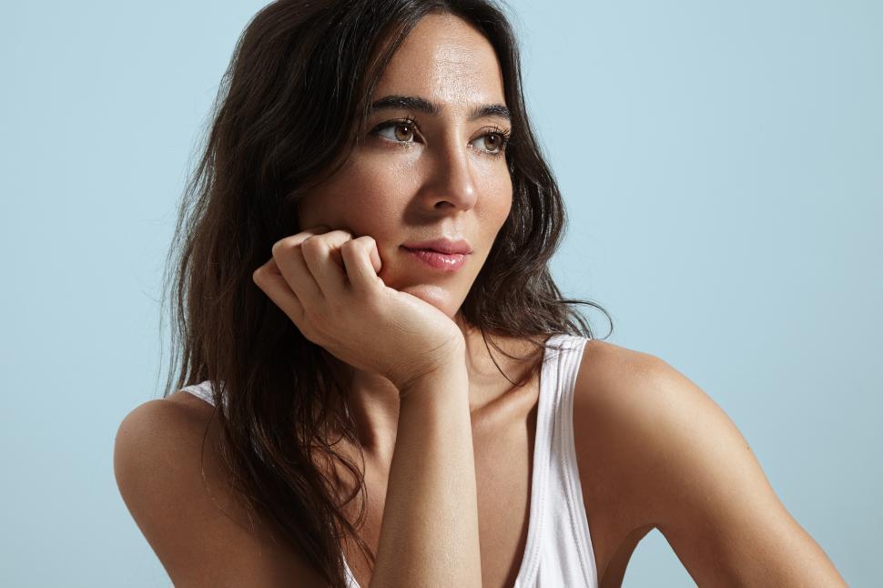 Free Image of beautiful spanish woman with chin resting on her hand 