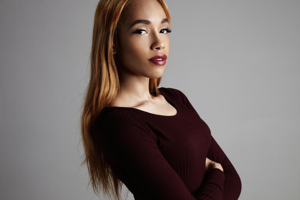 Free Image of Portrait of a black woman, dramatic serious look with arms crossed 