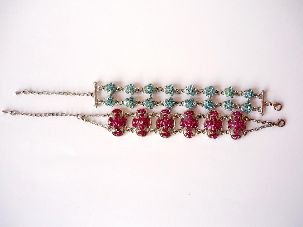 Free Image of Row of Red and Green Beaded Bracelets 