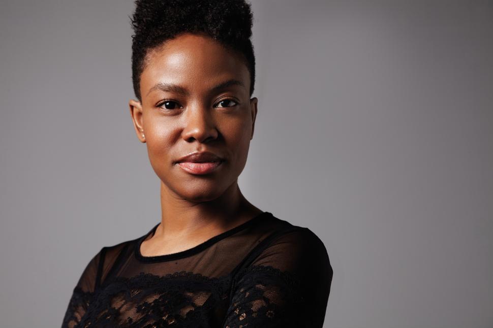 Free Image of black woman looking at camera, short haircut ideal skin 