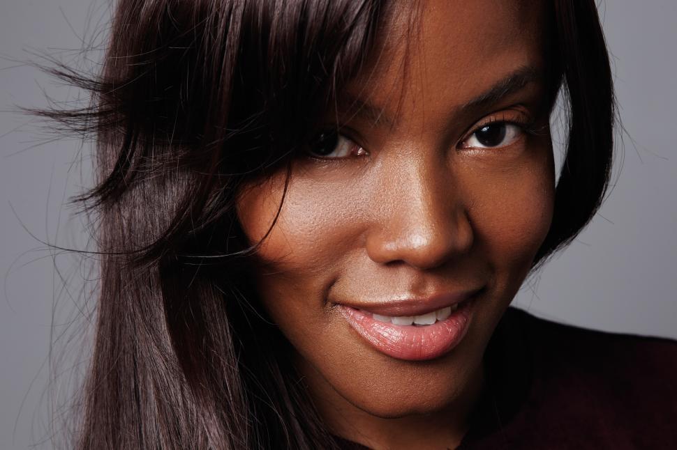 Free Image of closeup portrait of mixed race woman with ideal skin and straight hair 