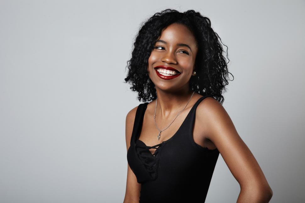 Free Image of pretty young black woman with short curly hair 