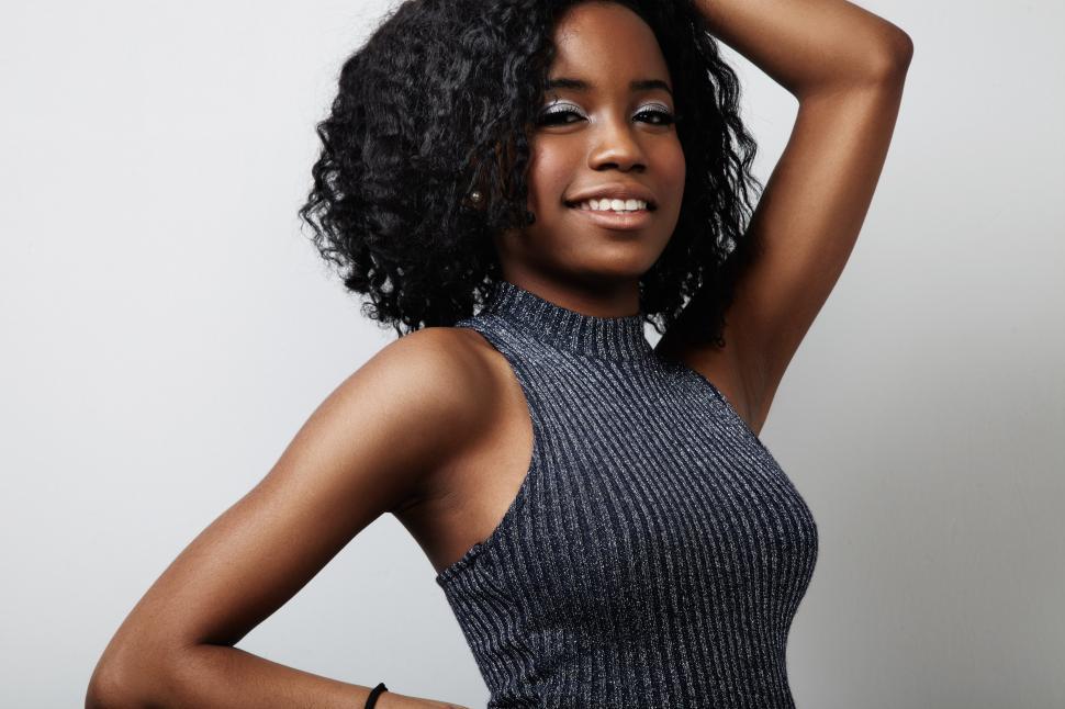 Free Image of black woman with curly hair and metallic eyeshadows 