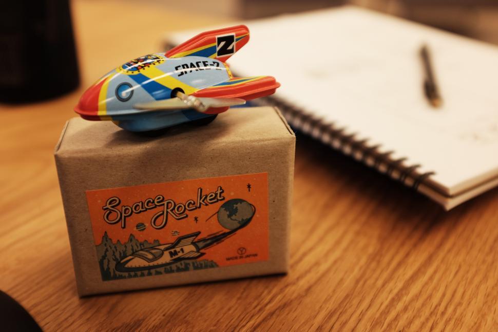 Free Image of A small toy airplane on a box 