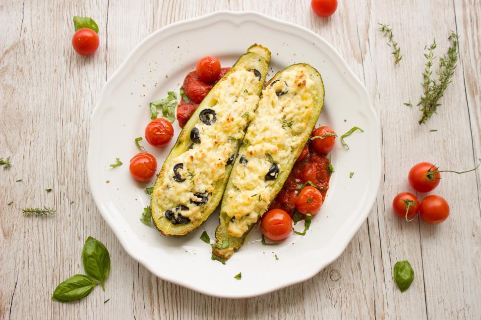 Free Image of A plate of food on a wood surface 