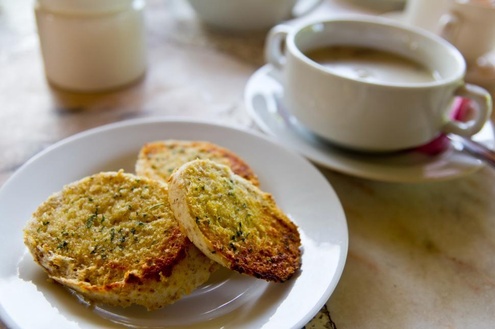 Free Image of Food on a plate next to a cup of coffee 