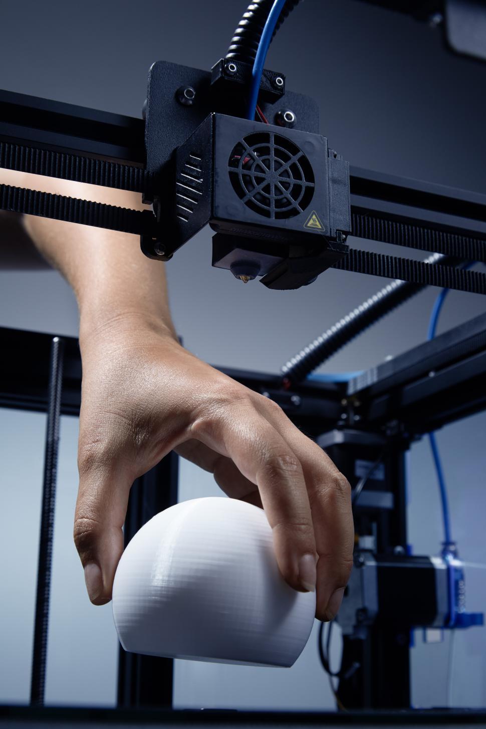 Free Image of Lifting object from a 3d printer 
