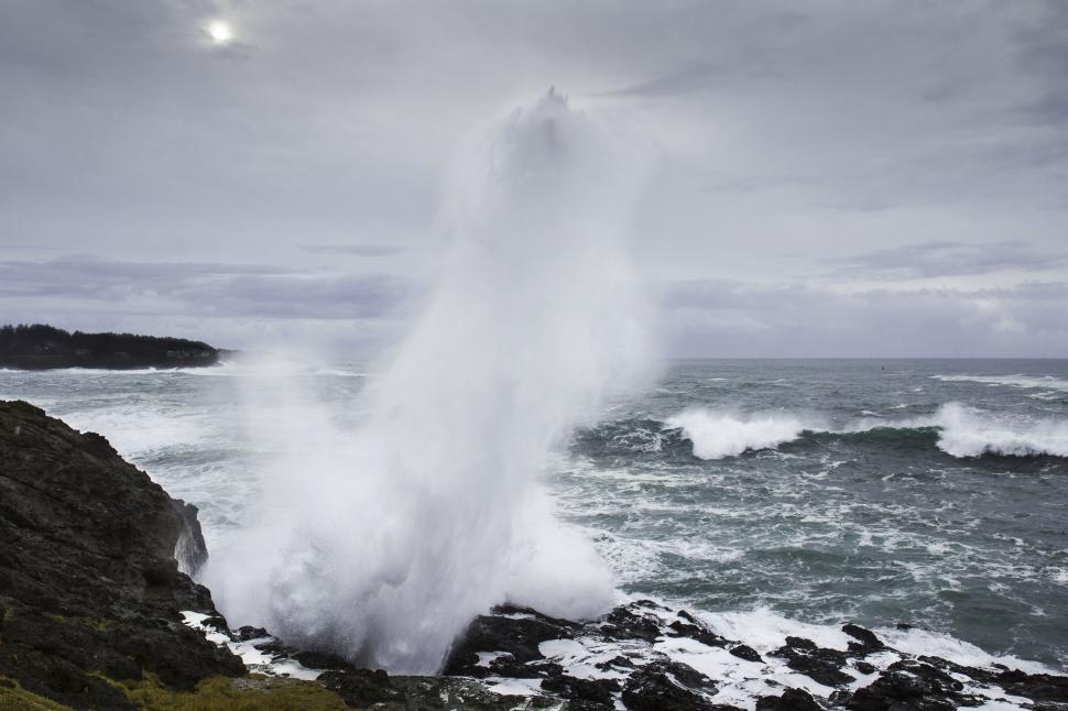 Free Image of A water splashing out of the ocean 