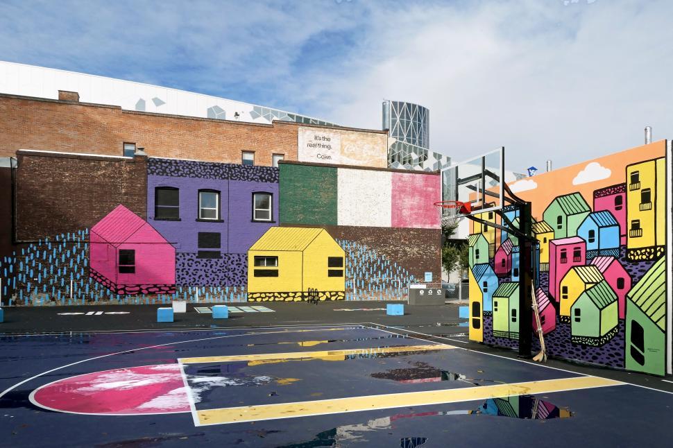 Free Image of A colorful building with a basketball court 
