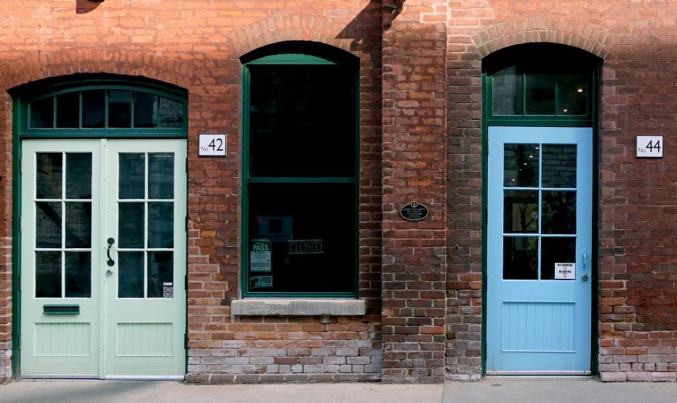 Free Image of A brick building with a sign on the side 