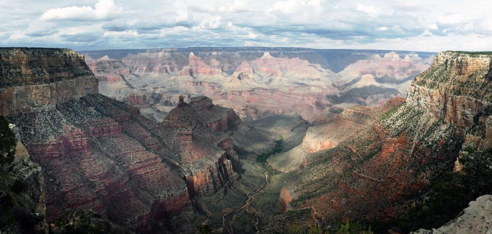 Free Image of A large canyon with a river running through it 