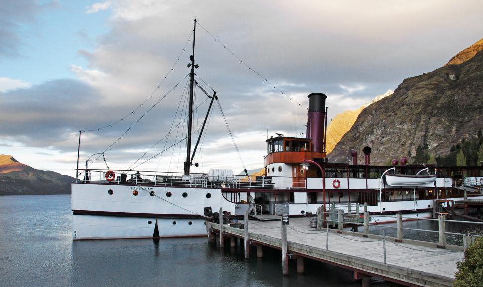 Free Image of A boat docked at a dock 