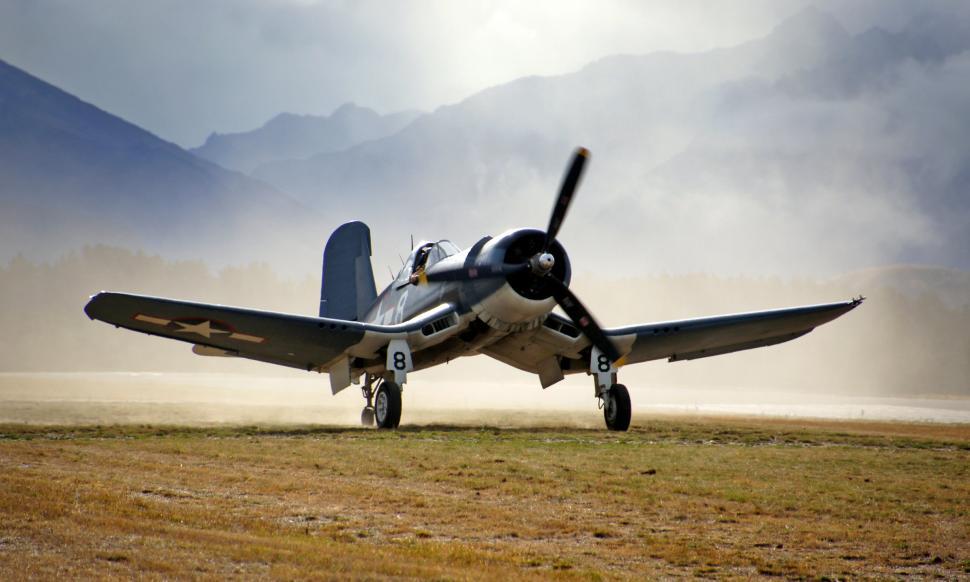 Free Image of An airplane on a field 