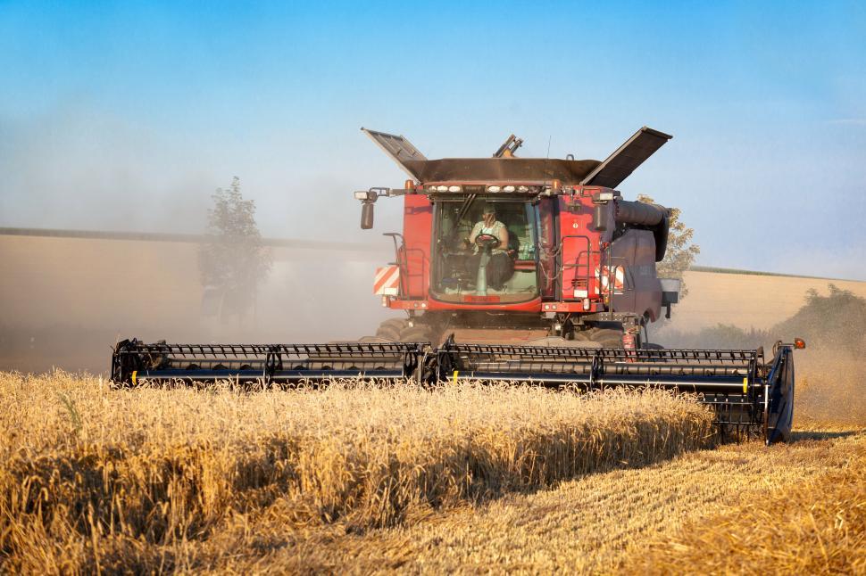 Free Image of A red tractor in a field 