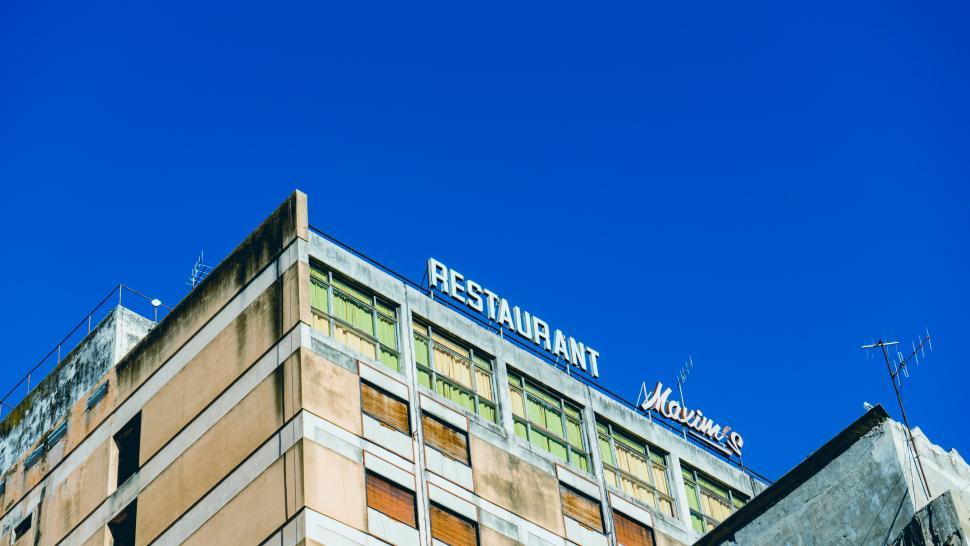 Free Image of A building with a sign on top 