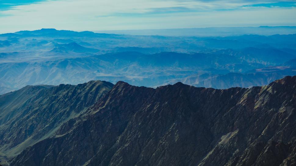 Free Image of A mountain range with blue sky 