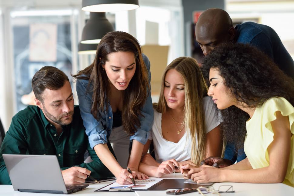 Free Image of Multi-ethnic group of young men and women studying indoors. 