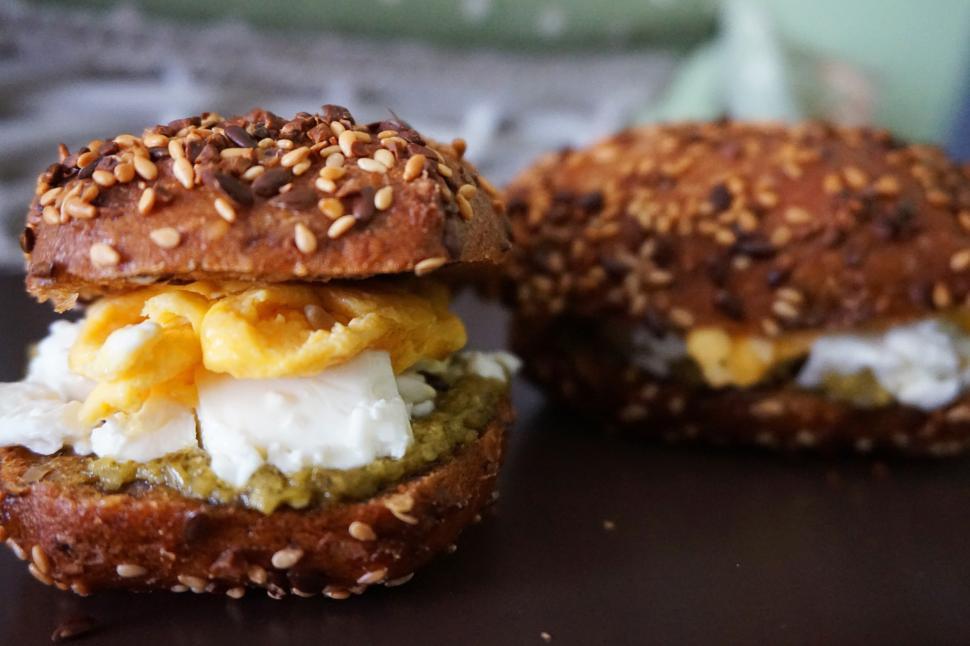 Free Image of A sandwich with eggs and pesto on top 