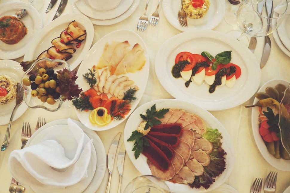 Free Image of A table with plates of food 