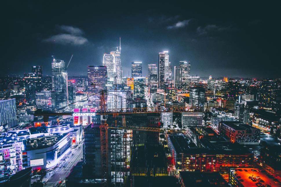 Free Image of A city at night with many tall buildings 