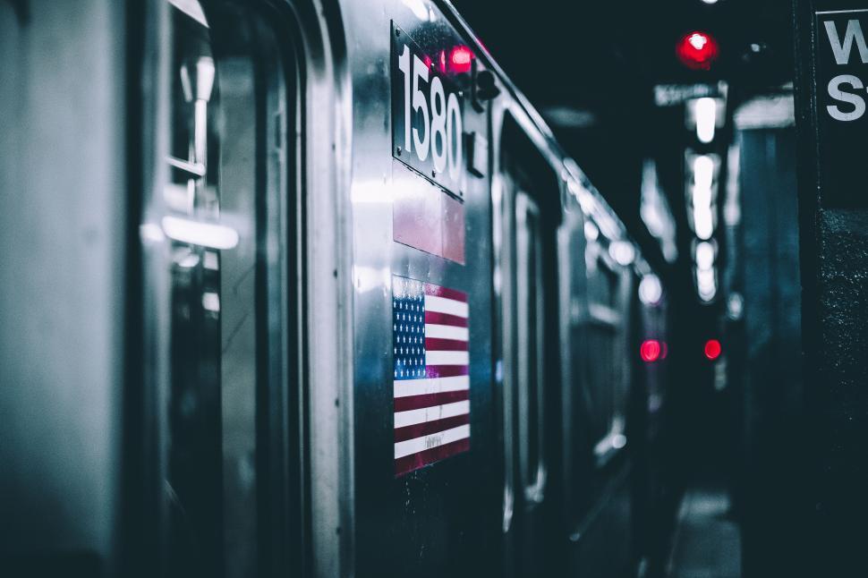 Free Image of A train with a flag on it 