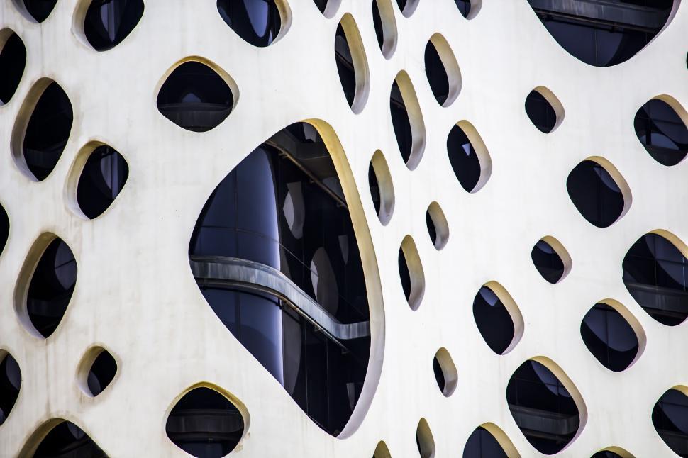 Free Image of A white building with holes in it 