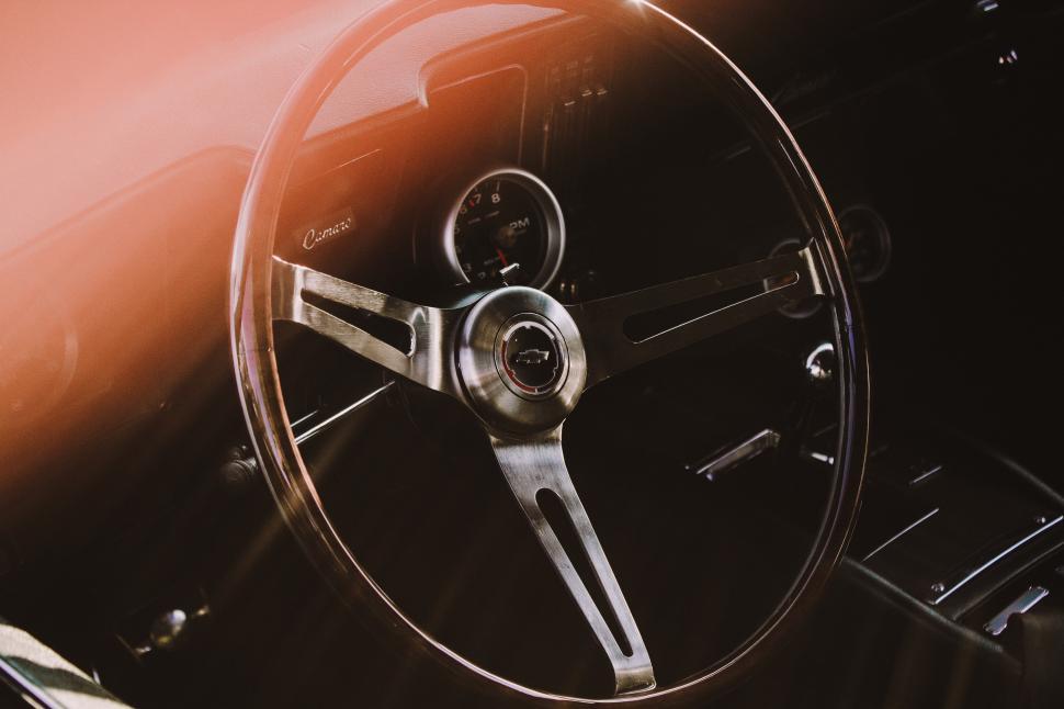 Free Image of A steering wheel and dashboard of a car 