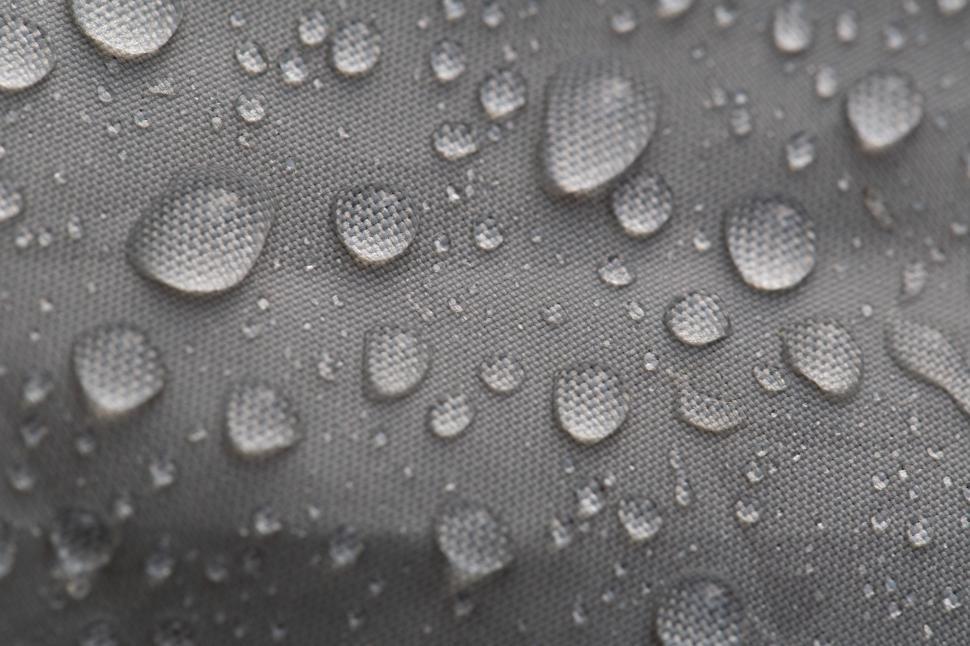 Free Image of Water droplets on a fabric surface 