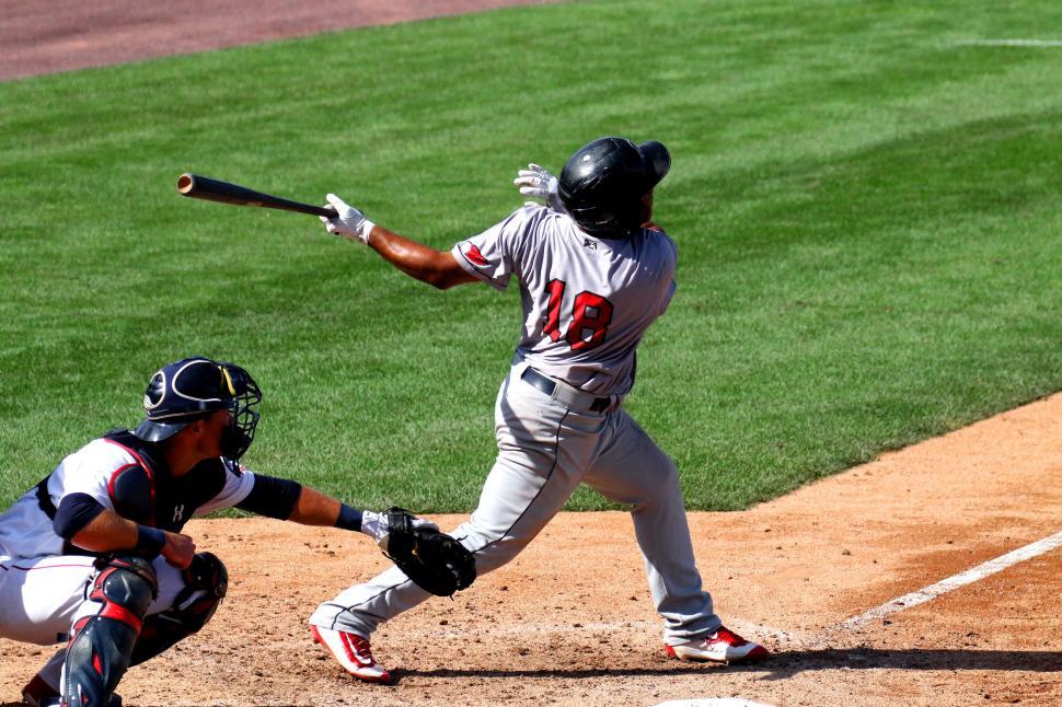 Free Image of A baseball player swinging a bat 