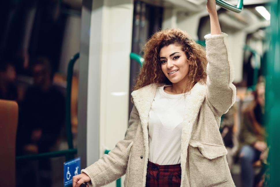 Free Image of Young beautiful Arab woman inside subway train. 
