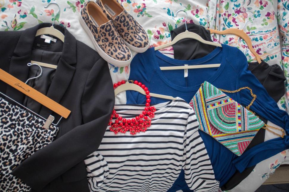 Free Image of A group of clothes on a bed 