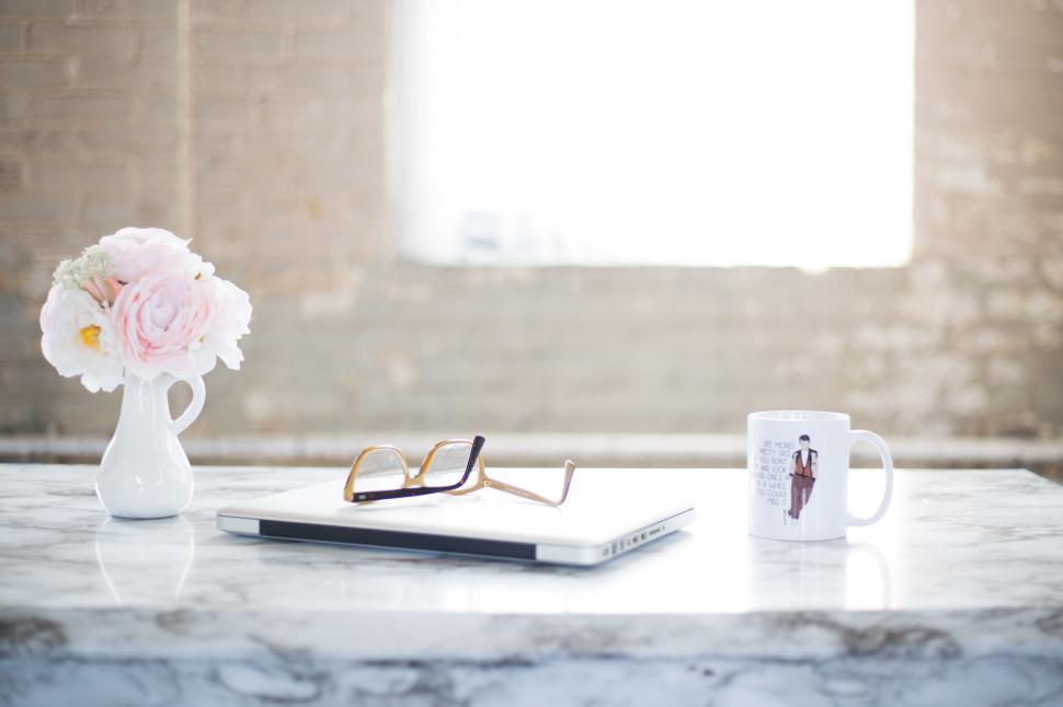 Free Image of Table With Vase of Flowers and Book 