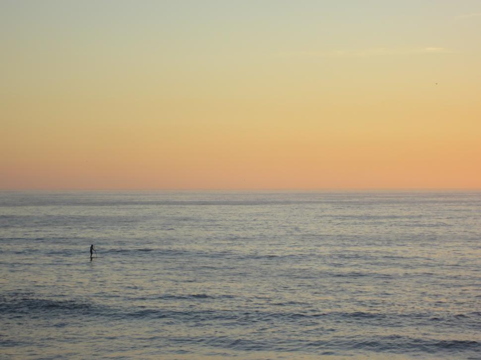 Free Image of A person on a surfboard in the ocean 