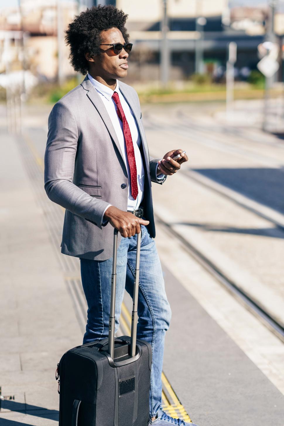 Free Image of Black Businessman waiting for the next train 