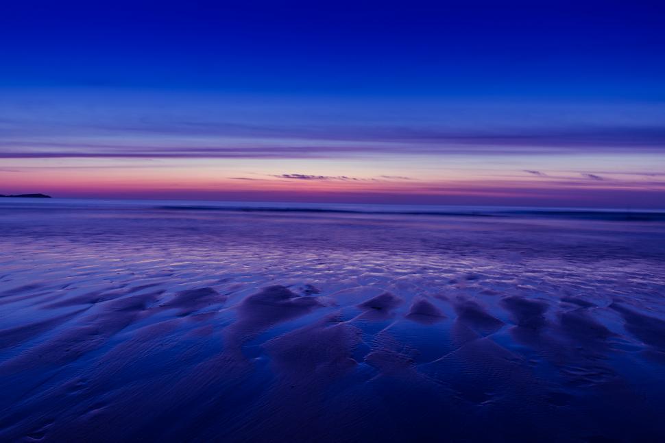 Free Image of A beach with a sunset 