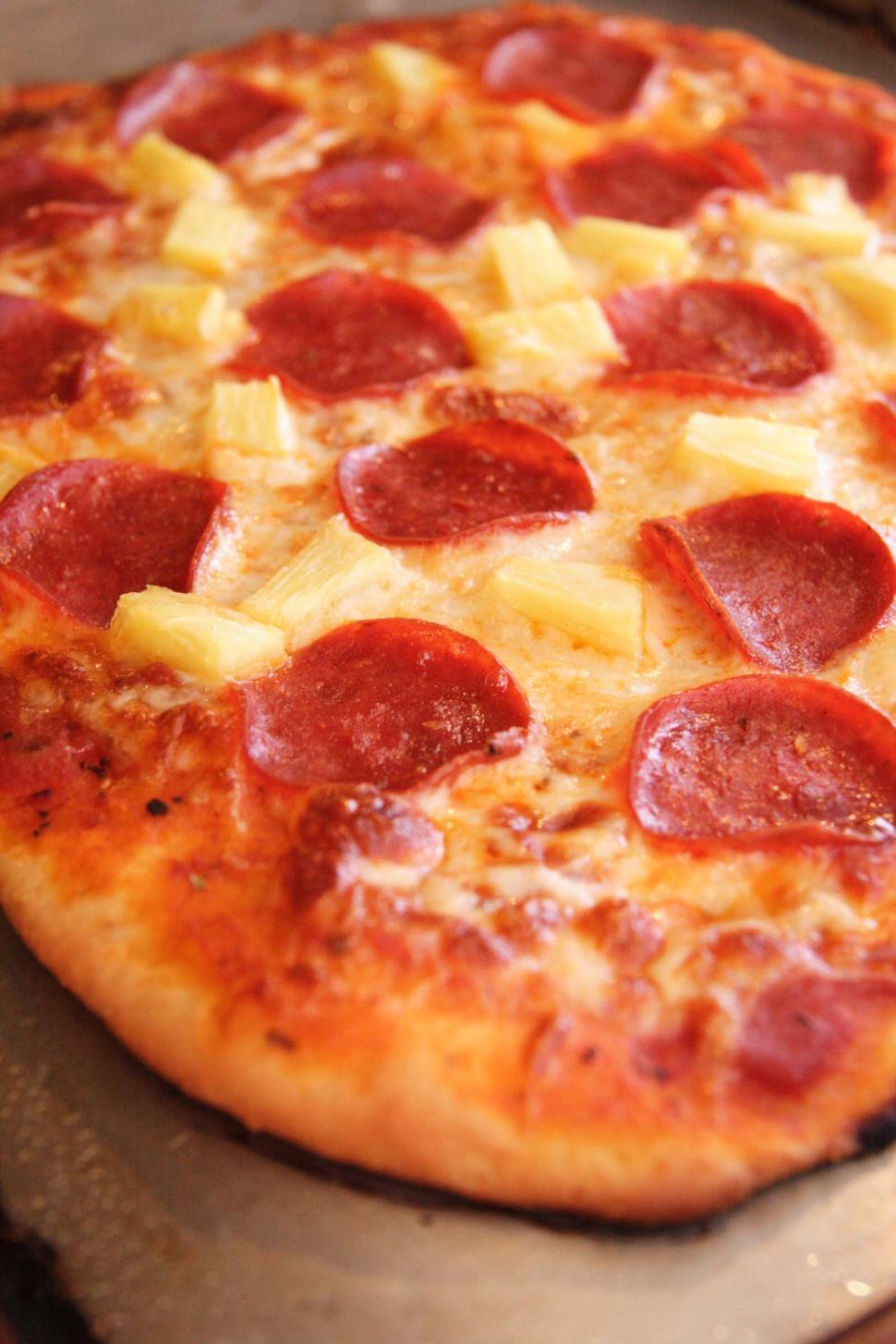 Free Image of Pizza with pineapple and pepperoni 