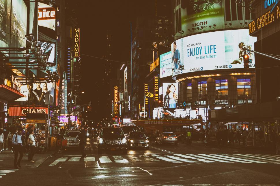 Free Image of A city street with many buildings and people 