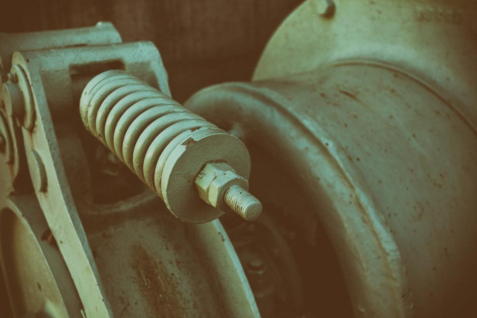 Free Image of A metal spring and a bolt 