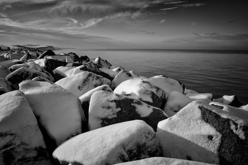 Free Image of A group of rocks covered in snow 