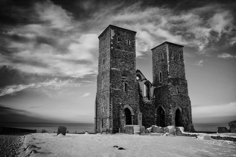 Free Image of A stone building with two towers in the snow 